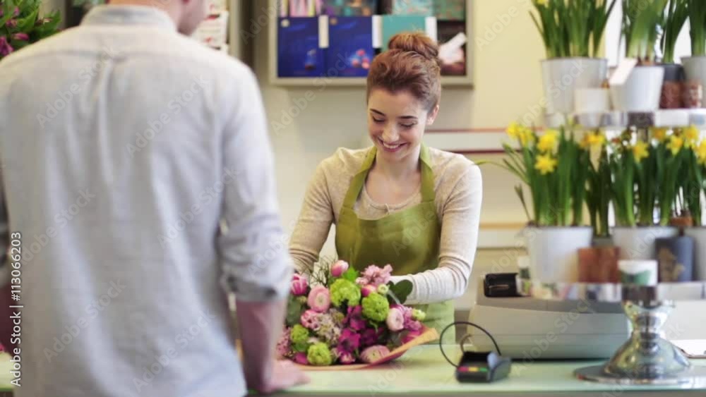 florist woman with flowers and man at flower shop florist woman with flowers and man at flower shop