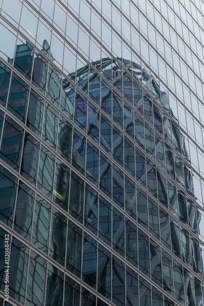 Skyscrapers with glass facade. Modern buildings in Paris business district. Concepts of economics, financial, future. Copy space for text. Dynamic composition. Skyscrapers with glass facade. Modern buildings in Paris business district. Concepts of economics, financial, future. Copy space for text. Dynamic composition.