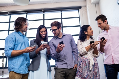 Group of hipsters using a smartphone