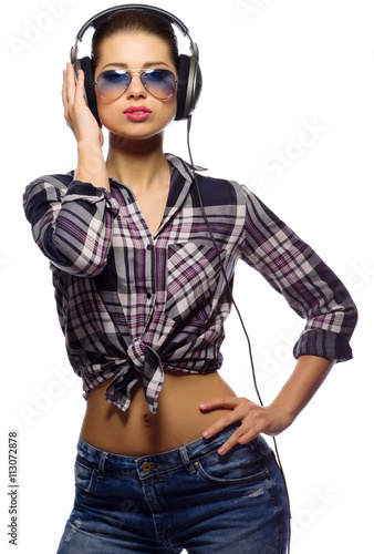 Young girl in blue jeans listen music © Boris Riaposov