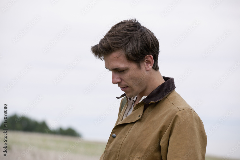 Man Looking down, close-up Man Looking down, close-up