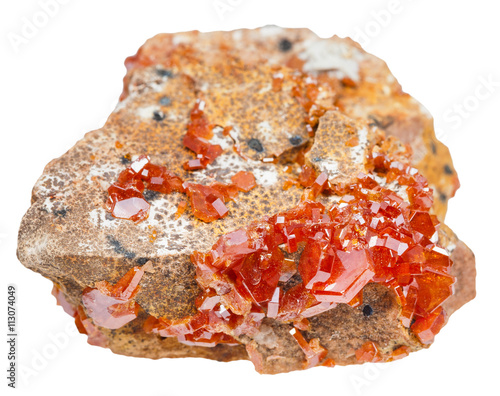 druse of red vanadinite crystals on rock isolated