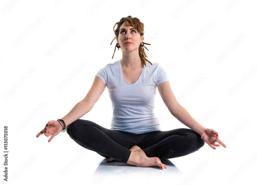 Young girl with dreadlocks doing yoga Young girl with dreadlocks doing yoga