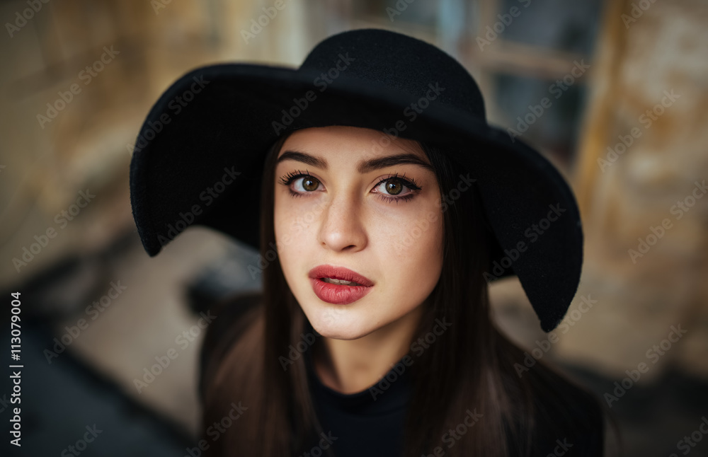 Street portrait of young casual lady in hat, black clothes, red lips Street portrait of young casual lady in hat, black clothes, red lips