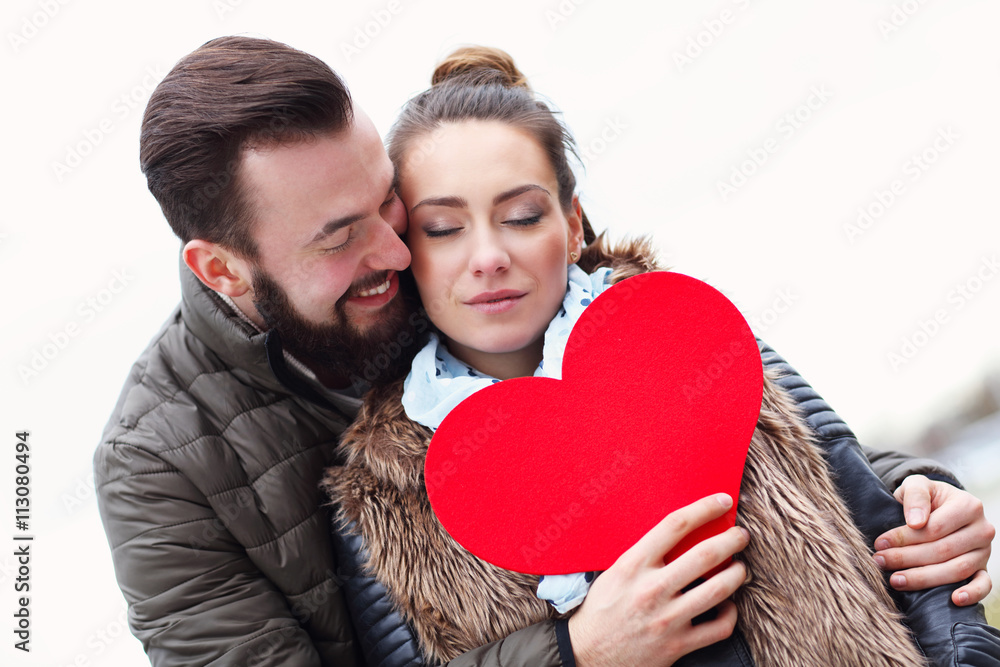 Romantic couple holding heart