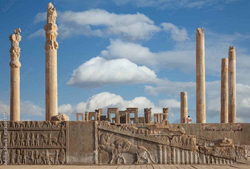 Ruins of Persepolis UNESCO World Heritage Site Against Cloudy Blue Sky in Shiraz City of Iran