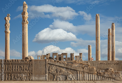Ruins of Persepolis UNESCO World Heritage Site Against Cloudy Blue Sky in Shiraz City of Iran photo