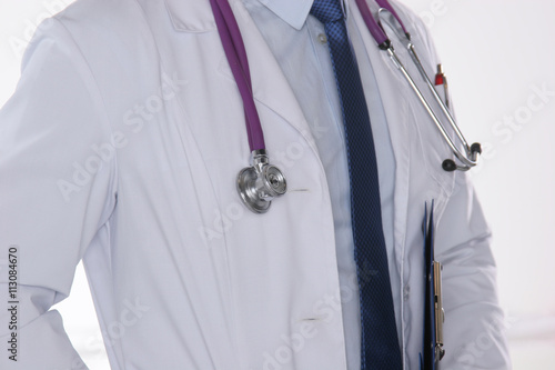 Male doctor with stethoscope isolated on white background