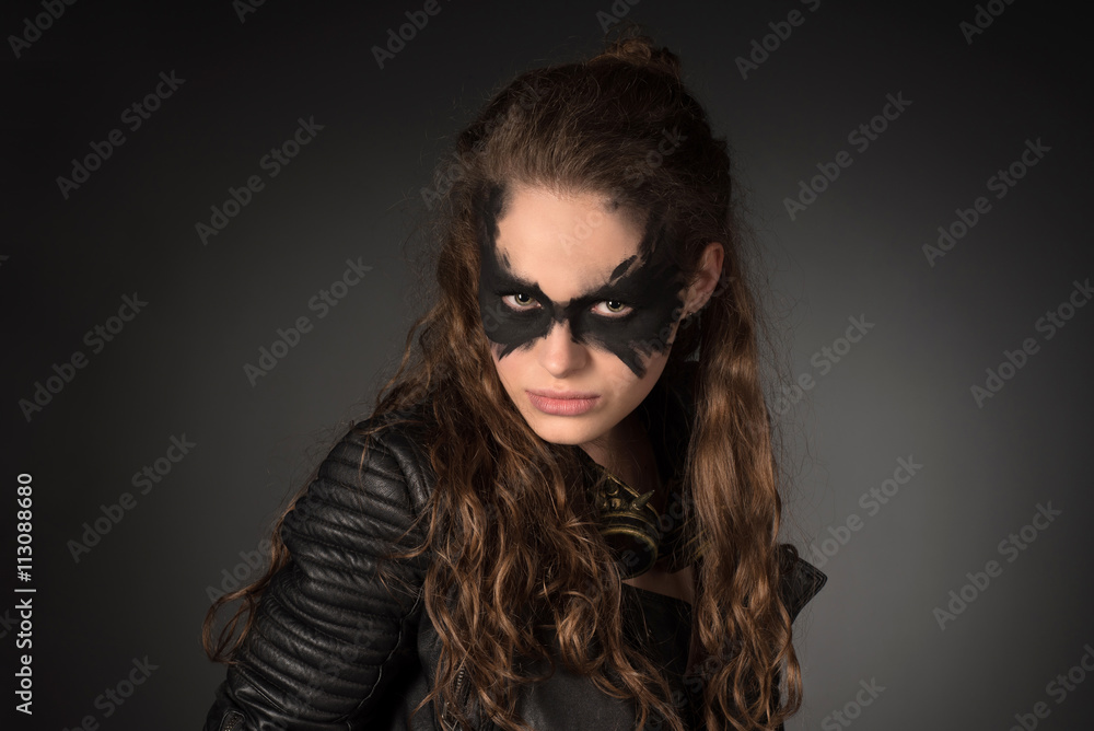 Subculture, fantasy concept. Portrait of wild, tough girl holdin Subculture, fantasy concept. Portrait of wild, tough girl holdin