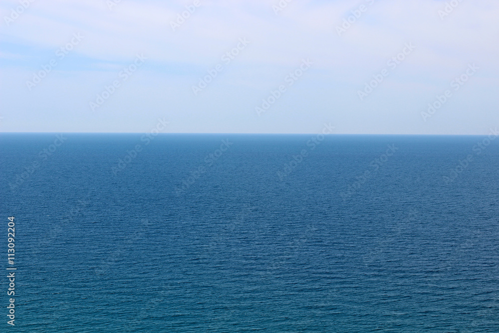 Blue sea waters and clear blue sky horizon Blue sea waters and clear blue sky horizon