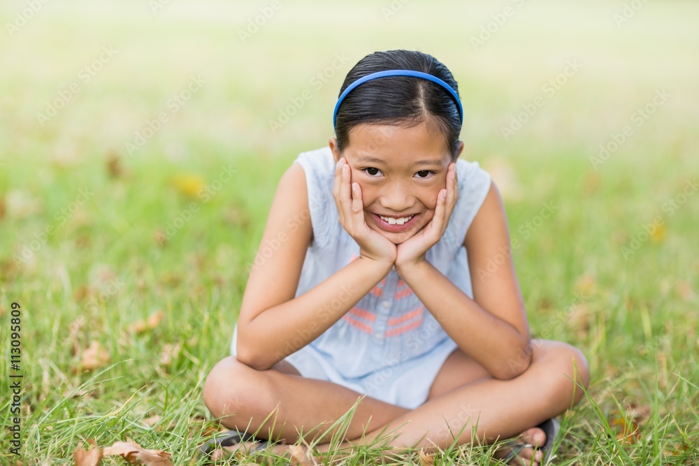 Portrait of smiling girl sitting with hand face Portrait of smiling girl sitting with hand face
