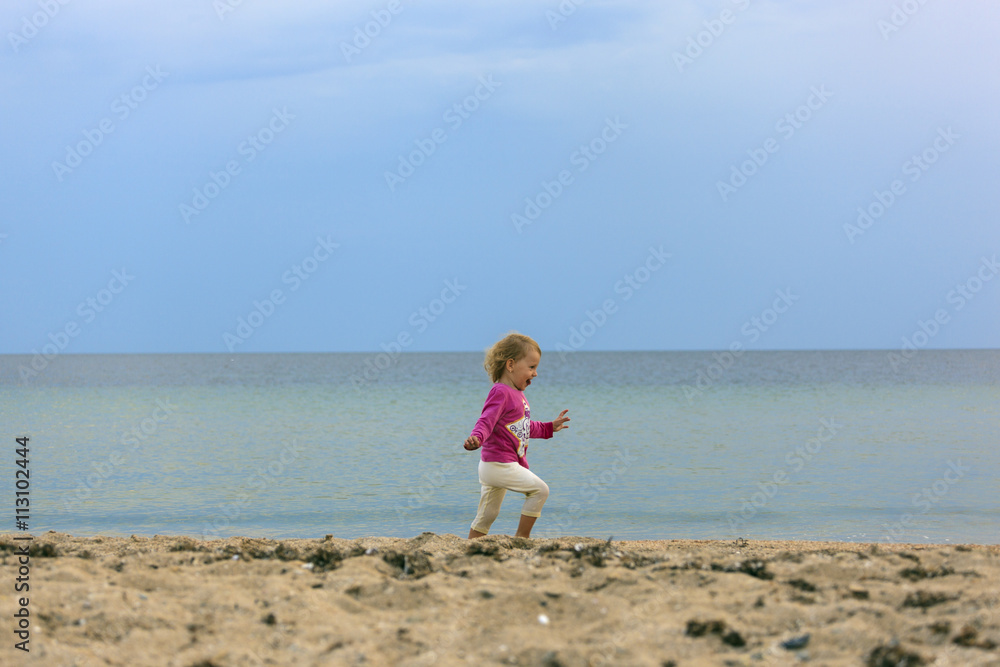 Girl runs on sand