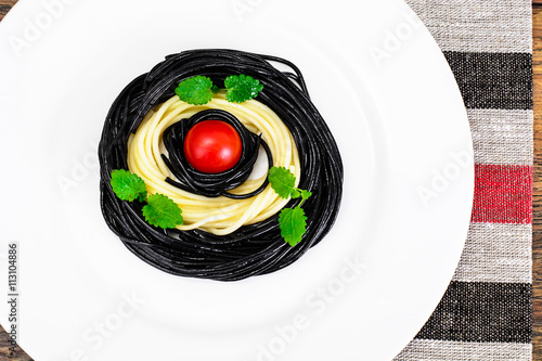 Black Spaghetti with Cuttlefish Ink, Tomato and Basil. Mediterra photo