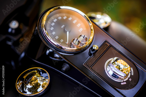 wedding rings on a motorcycle speedometer