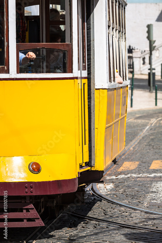 Romantic yellow tramway - main symbol of Lisbon, Portugal