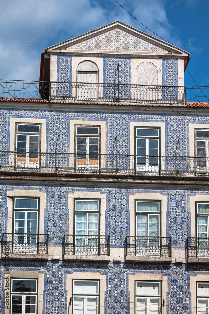 Fototapeta premium Lisbon buildings with typical traditional portuguese tiles on th