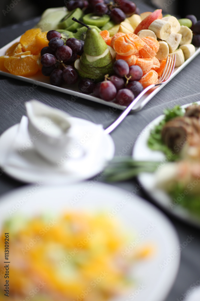 Fruit platter in focus on a served table Fruit platter in focus on a served table