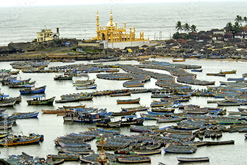 Fishing boats in harbour, coastal area of Vizhinjam, Trivandrum, Kerala photo