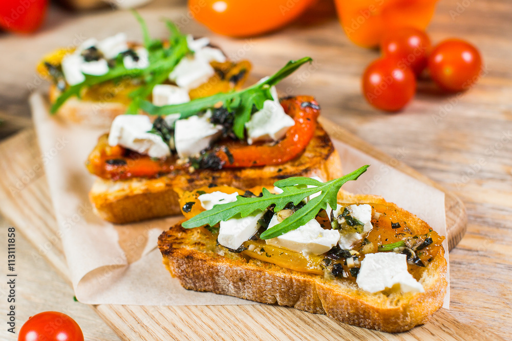 Beautiful fresh sandwiches with cheese, tomatoes and arugula Beautiful fresh sandwiches with cheese, tomatoes and arugula