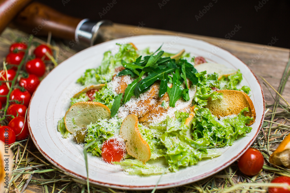 Beautiful fresh salad with lettuce, tomatoes, croutons and Parmesan cheese Beautiful fresh salad with lettuce, tomatoes, croutons and Parmesan cheese