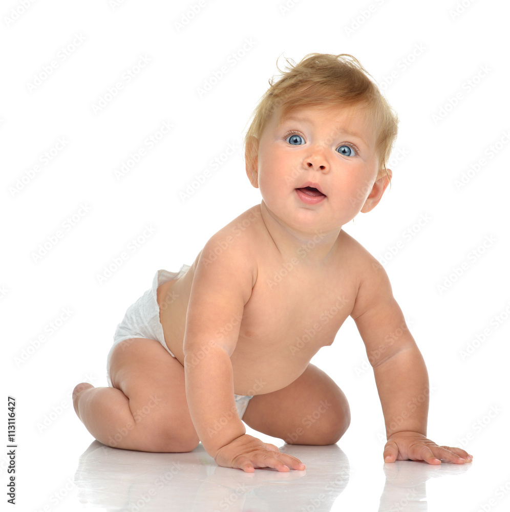 Infant child baby girl in diaper crawling happy looking at the c Infant child baby girl in diaper crawling happy looking at the c