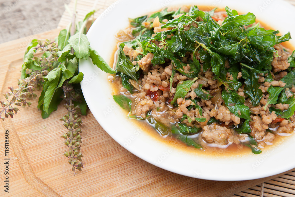 stir-fried pork and basil thai food with spoon stir-fried pork and basil thai food with spoon
