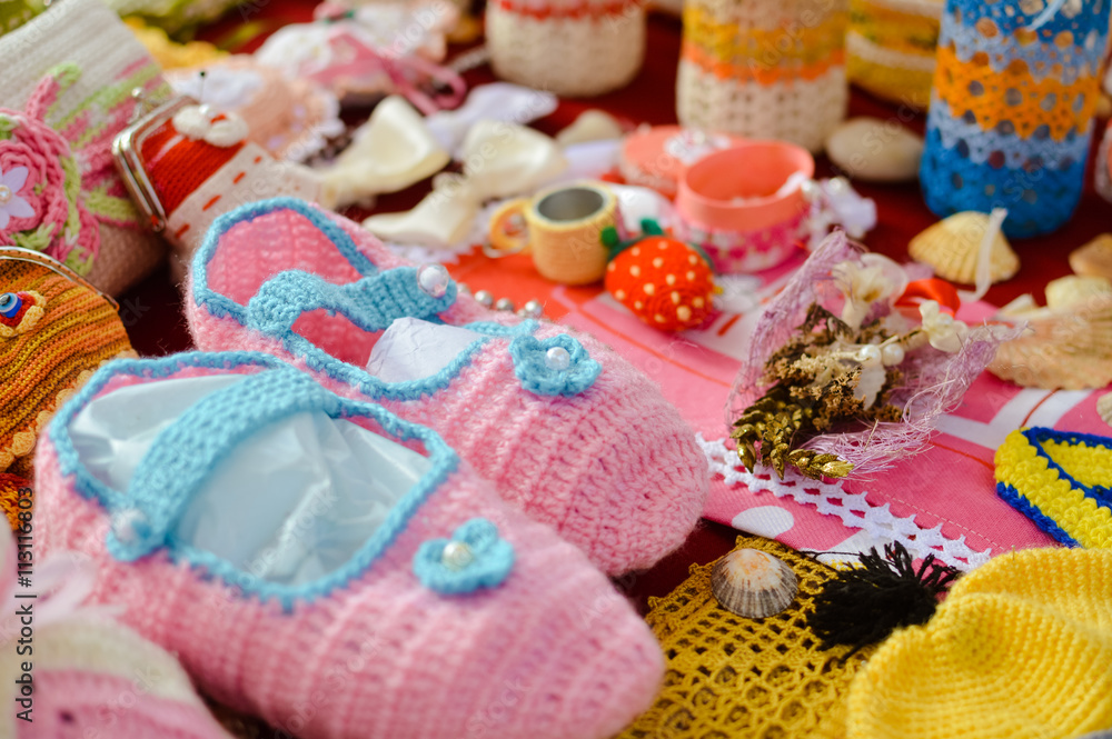 Knitted goods displayed on market stall for sale. Knitted goods displayed on market stall for sale.