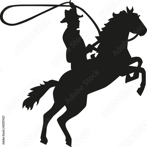 Cowboy rodeo rider with lasso on horse
