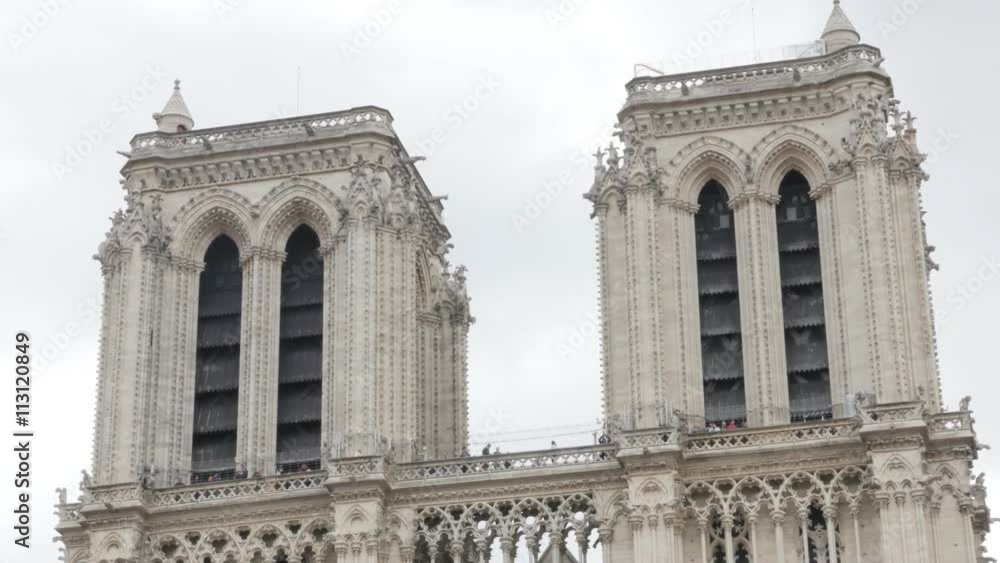 Famous Notre-Dame Cathedral in France Paris slow tilt 4K 2160p UltraHD footage - French Notre Dame de Paris church by the day 4K 3840X2160 UHD video Famous Notre-Dame Cathedral in France Paris slow tilt 4K 2160p UltraHD footage - French Notre Dame de Paris church by the day 4K 3840X2160 UHD video