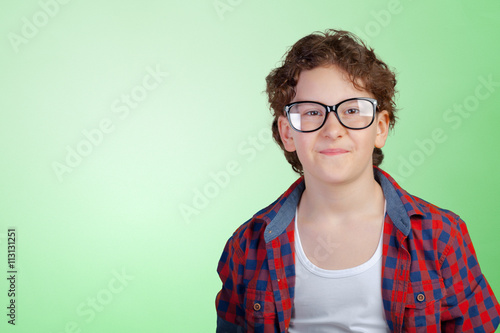 Portrait of young boy wearing glasses
