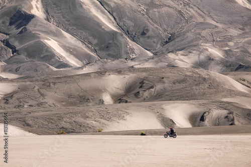 Dark sand dunes inside Mount Bromo volcano caldera, Java, Indonesia photo