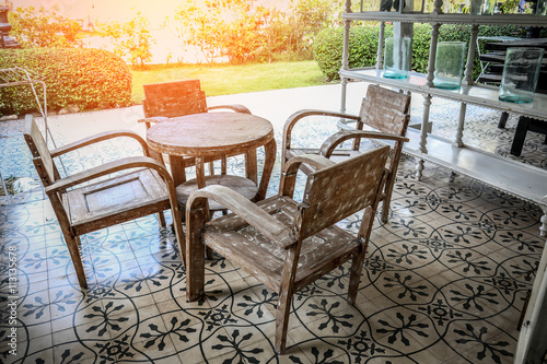 Table and chairs in a tropical garden