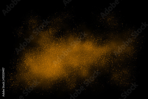 Orange abstract powder explosion on a black background © Christopher Hall