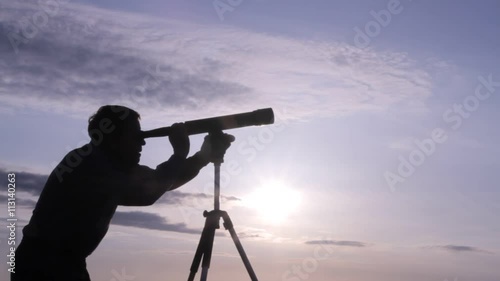 Wallpaper Mural silhouette of a man watching through a telescope Torontodigital.ca