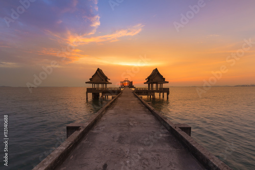 Abandon temple in the ocean with beautiful sky background after sunset photo