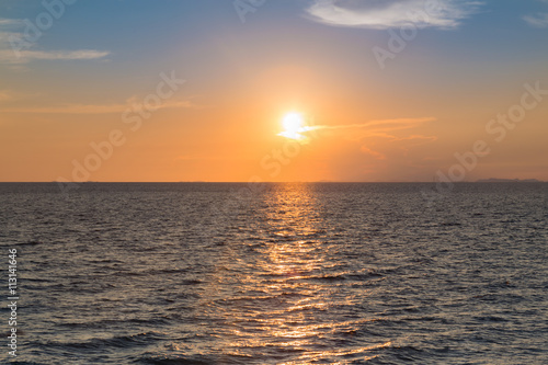 Sunset over seacoast skyline  natural landscape background