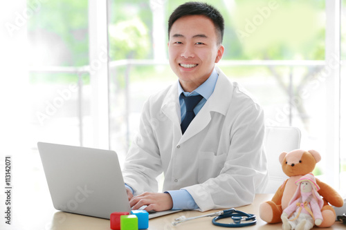 Handsome pediatrician docto...
