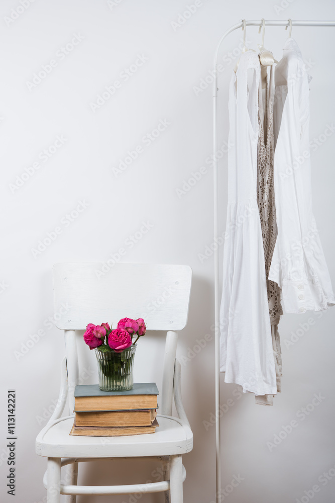 bedroom white interior, clothes on the hanger bedroom white interior, clothes on the hanger