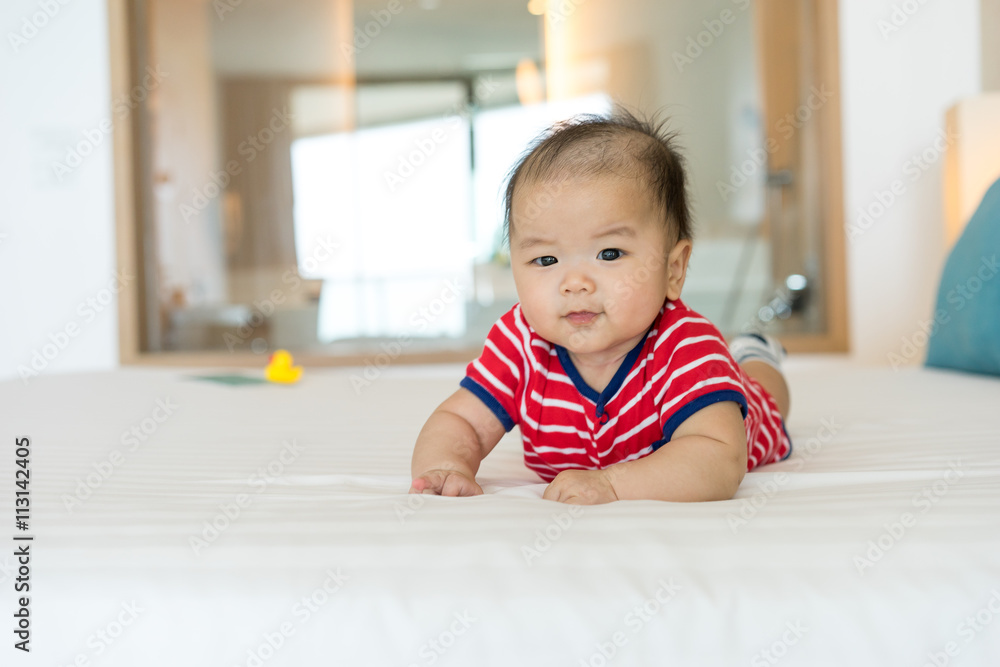 Portrait of a newborn Asian baby on the bed Portrait of a newborn Asian baby on the bed