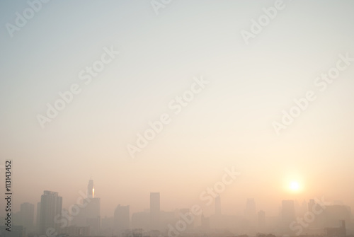 smog cityscape at sunset and blue sky
