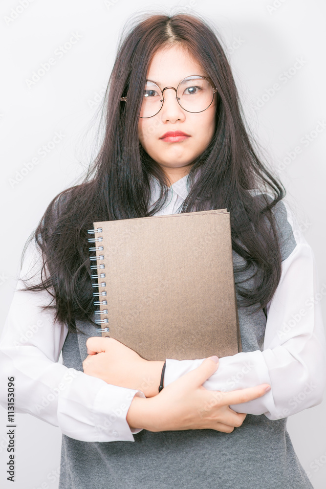 Nerd beautiful young asian school girl hold lecture book Nerd beautiful young asian school girl hold lecture book