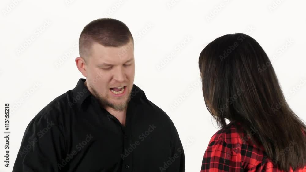 Man swears to his woman and gesturing with hands. White Man swears to his woman and gesturing with hands. White