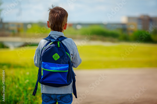 Little boy with a backpack go to school. Back view © Volha Zaitsava