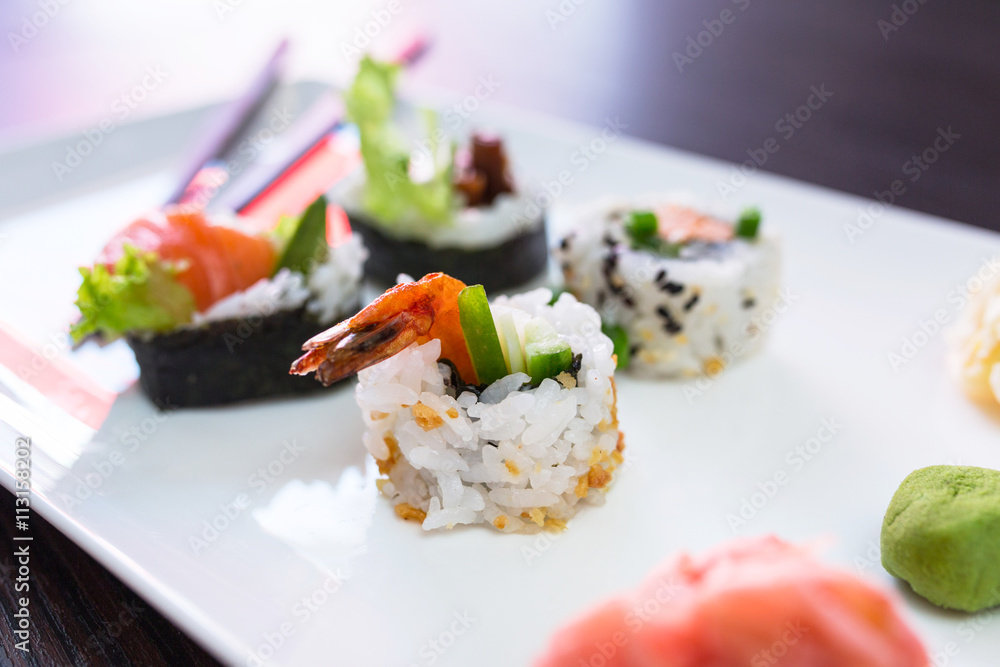 Sushi set with chopsticks on the plate Sushi set with chopsticks on the plate