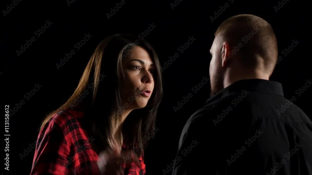 Conflict of couple with shouting. Isolated on black background Conflict of couple with shouting. Isolated on black background