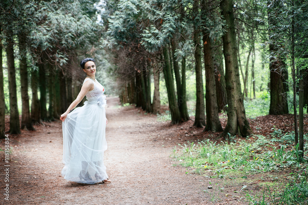 bride, girl in white dress in the park
