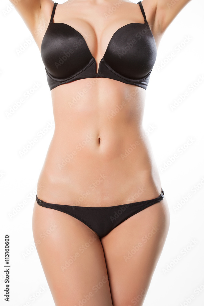 Close up photo of slim woman's body in white lingerie Close up photo of slim woman's body in white lingerie