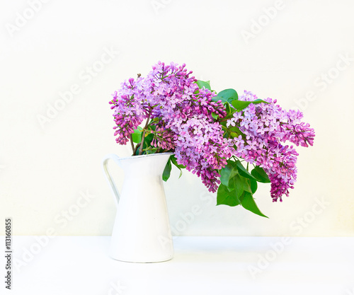 Wallpaper Mural branch of lilac in a vase on white background with shadow Torontodigital.ca