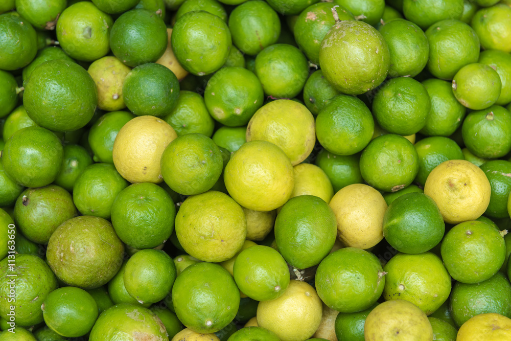 Stack of limes on display at farmers market Stack of limes on display at farmers market