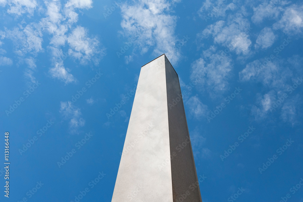 Obelisk column marble blue sky clouds Obelisk column marble blue sky clouds